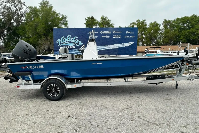 The Image of 2026 Vexus Defender 201 boat on trailer at Holiday Marine dealership. - 0