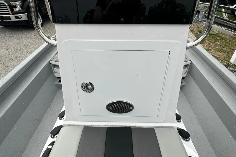 Slide: The Image of 2026 Vexus Defender 201 boat interior with storage compartment and seating. - 18