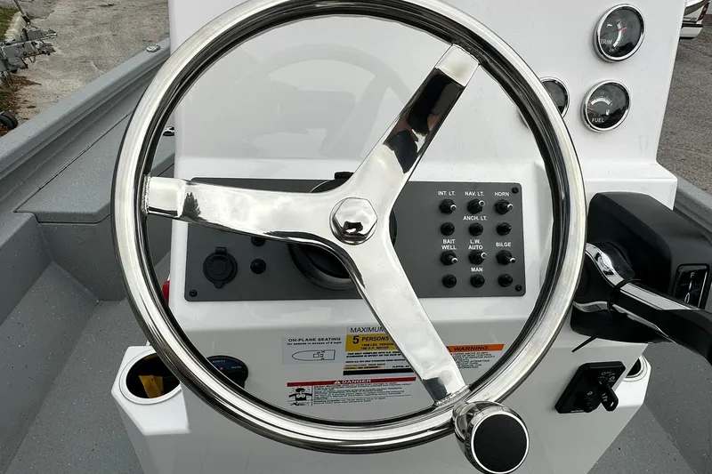Slide: The Image of Steering wheel and control panel of 2026 Vexus Defender 201 boat. - 23