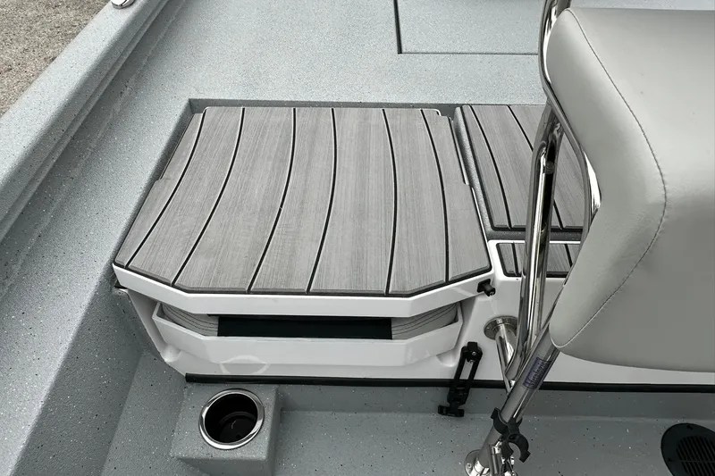 Slide: The Image of 2026 Vexus Defender 201 boat deck with gray seating and stainless steel railing. - 31