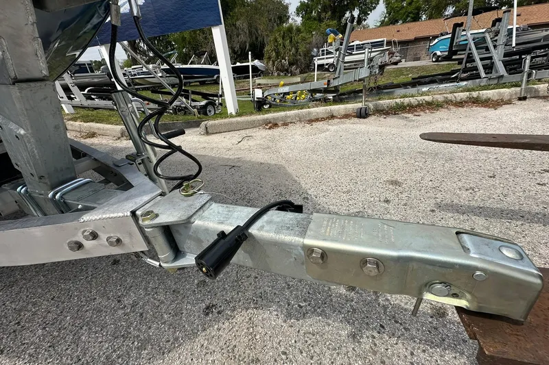 Slide: The Image of Trailer hitch of a 2026 Vexus Defender 201 boat, parked on a concrete surface. - 37