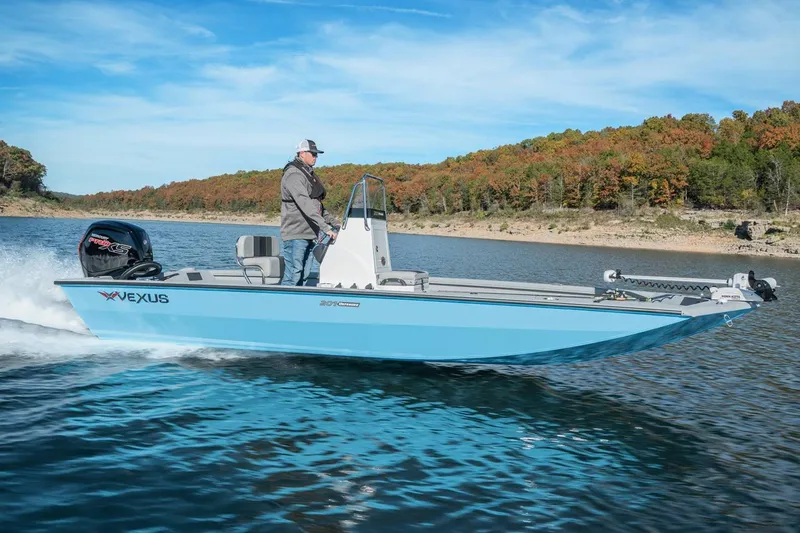 Slide: The Image of Manufacturer Provided Image: 2026 Vexus Defender 201 boat cruising on a scenic lake with autumn foliage. - 46
