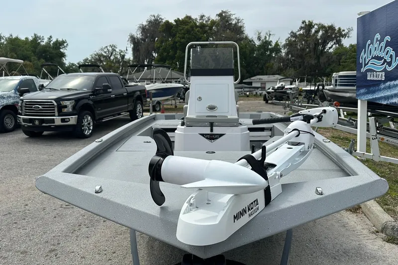 Slide: The Image of 2026 Vexus Defender 201 boat with Minn Kota trolling motor at Holiday Marine dealership. - 6
