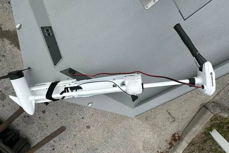 Slide: The Image of 2026 Vexus Defender 201 boat with Minn Kota trolling motor on deck. - 8