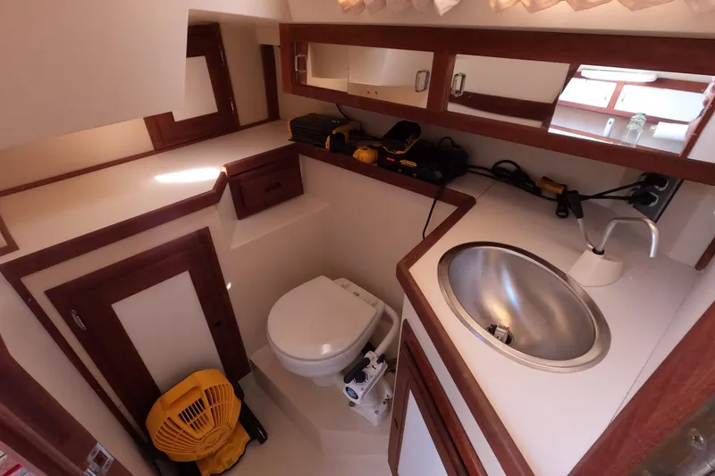 Slide: The Image of Interior of 1990 Catalina Capri 26 sailboat bathroom with sink and toilet. - 15