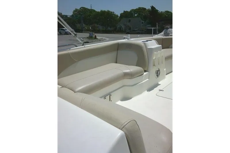 Slide: The Image of 2018 NauticStar 193 SC Deck boat interior with beige seating and speaker. - 17