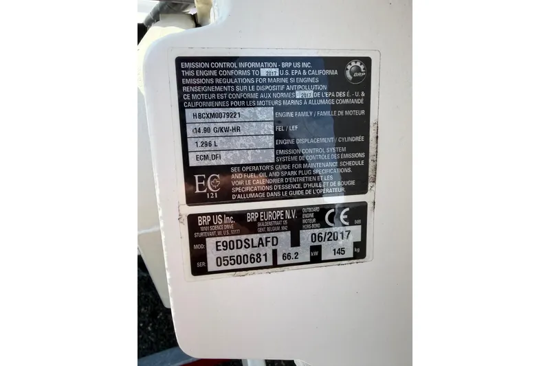 Slide: The Image of Emission control label on a 2004 Boston Whaler 150 Sport boat engine. - 13