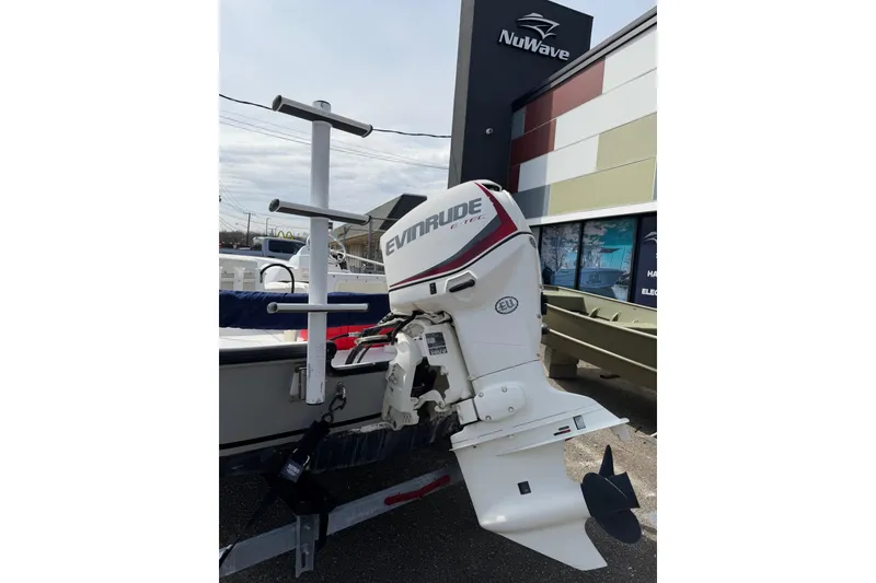 Slide: The Image of 2004 Boston Whaler 150 Sport with Evinrude E-TEC engine at NuWave dealership. - 4