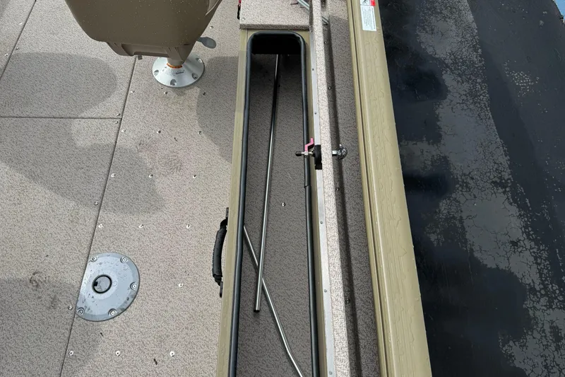 Slide: The Image of 2026 Lund 2075 Alaskan SS boat interior with rod storage compartment. - 19