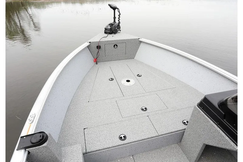 Slide: The Image of Manufacturer Provided Image: 2025 Lund 2075 Alaskan SS boat deck on calm water. - 2