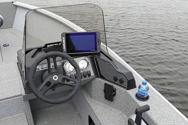 Slide: The Image of Manufacturer Provided Image: 2025 Lund 2075 Alaskan SS boat dashboard with steering wheel and navigation system. - 4