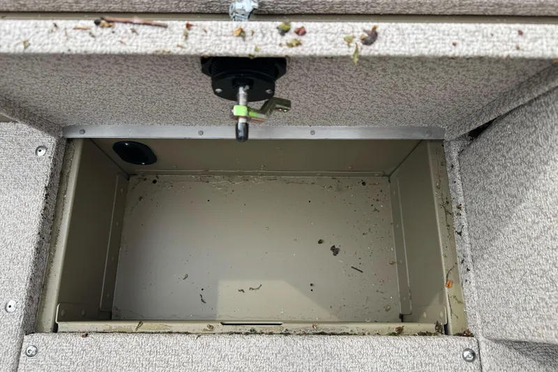 Slide: The Image of Open storage compartment in 2026 Lund 2075 Alaskan SS boat, showing interior details. - 9