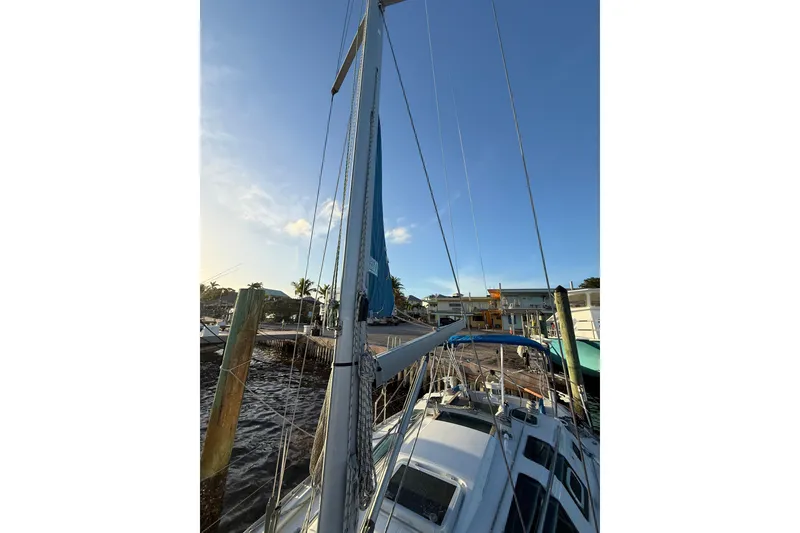 Slide: The Image of Sailboat docked at marina, Beneteau First 32s5, 1990 model, mast view. - 16