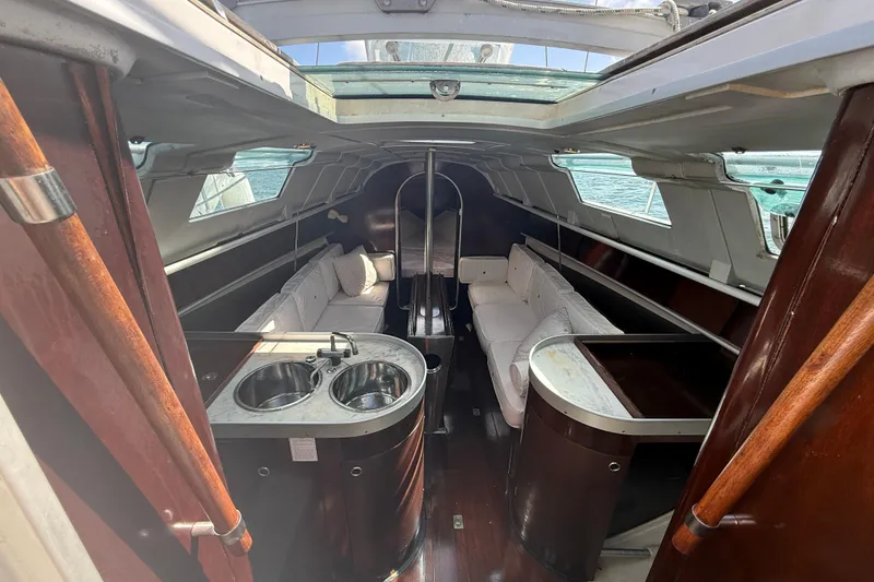 Slide: The Image of Interior of 1990 Beneteau First 32s5 sailboat with seating and kitchenette. - 22
