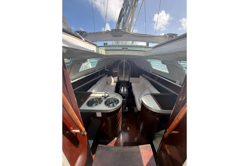 Slide: The Image of Interior of 1990 Beneteau First 32s5 sailboat with seating and dual sinks. - 23