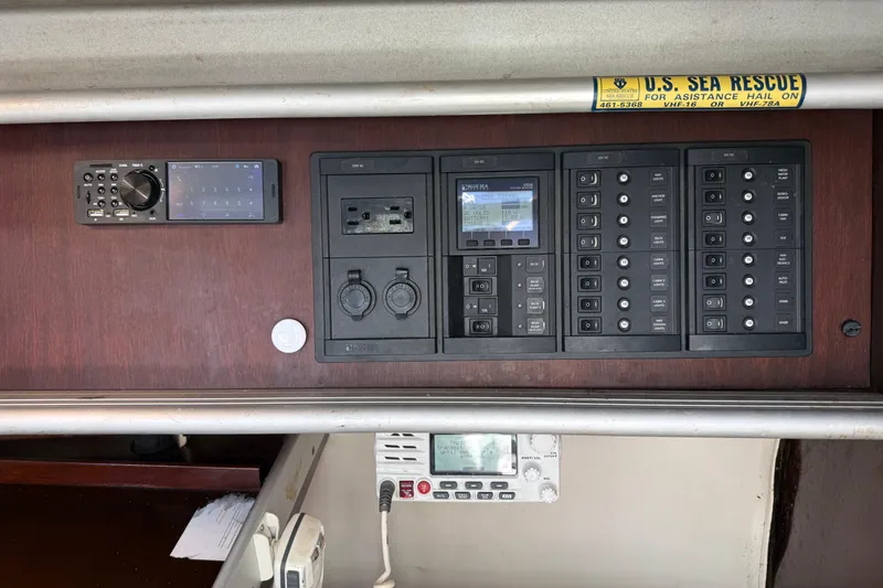 Slide: The Image of Control panel of a 1990 Beneteau First 32s5 sailboat with navigation and communication equipment. - 29