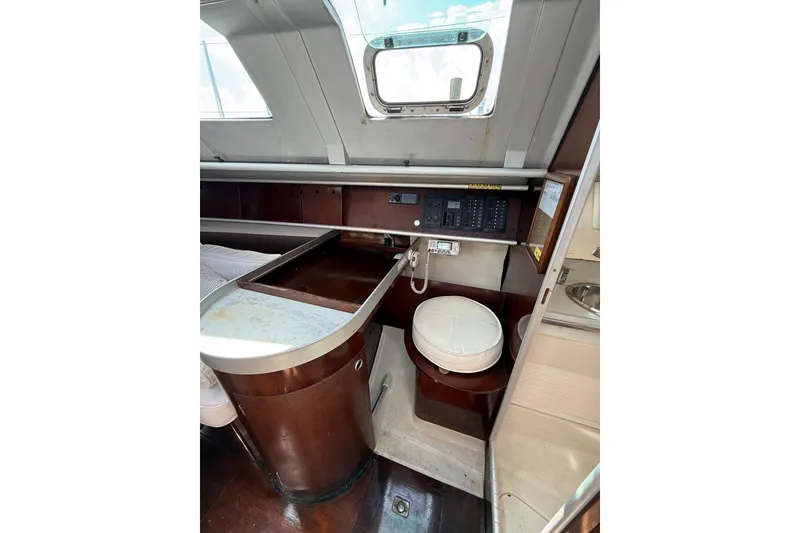 Slide: The Image of Interior of 1990 Beneteau First 32s5 sailboat with navigation station and seating. - 31