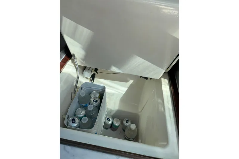 Slide: The Image of Open cooler with drinks inside on a 1990 Beneteau First 32s5 yacht. - 32