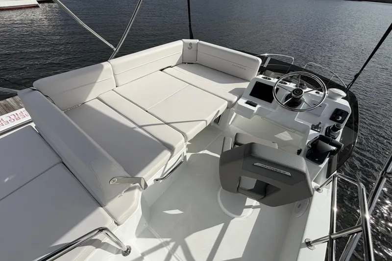 Slide: The Image of Flybridge of 2026 Beneteau Antares 11 Fly with helm and seating area. - 11
