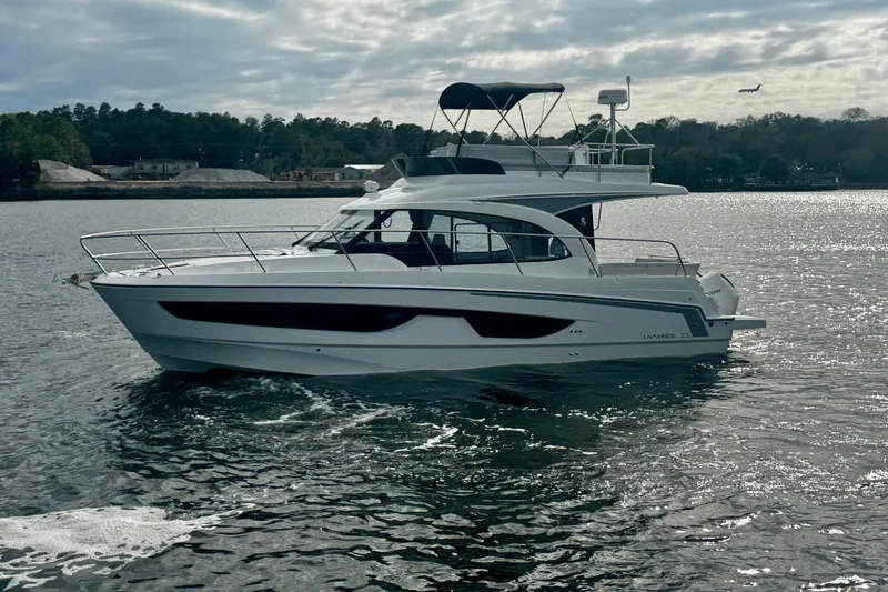 Slide: The Image of 2026 Beneteau Antares 11 Fly yacht cruising on a calm lake under cloudy skies. - 4