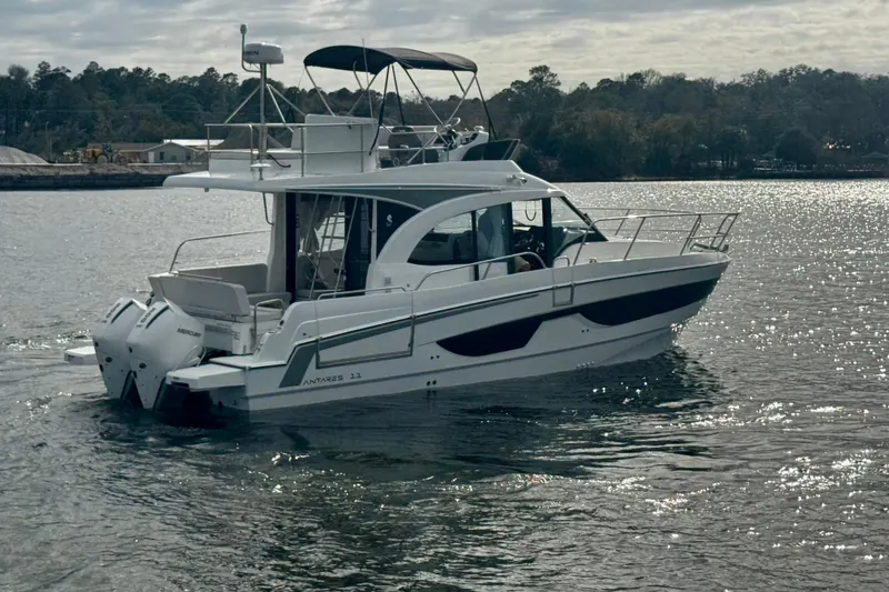 Slide: The Image of 2026 Beneteau Antares 11 Fly cruising on a calm lake under a cloudy sky. - 7