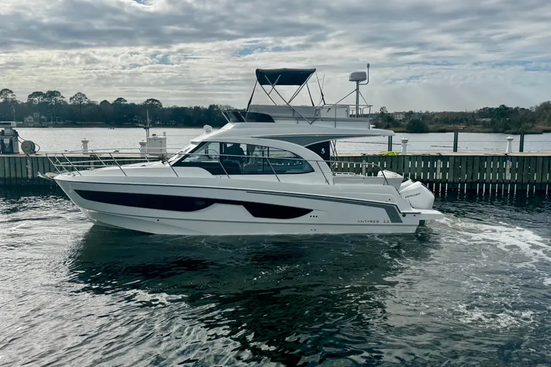 Slide: The Image of 2026 Beneteau Antares 11 Fly yacht on water, cloudy sky background. - 8