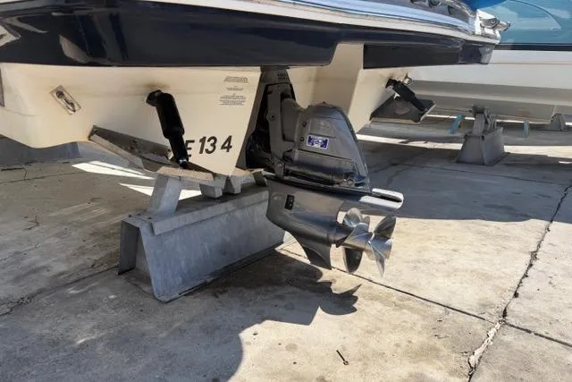 Slide: The Image of 2013 Chaparral 277 SSX boat on stands, showcasing propeller and stern drive. - 14