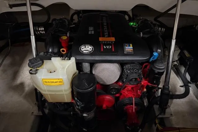 Slide: The Image of Engine compartment of a 2013 Chaparral 277 SSX boat, featuring a V8 engine. - 16