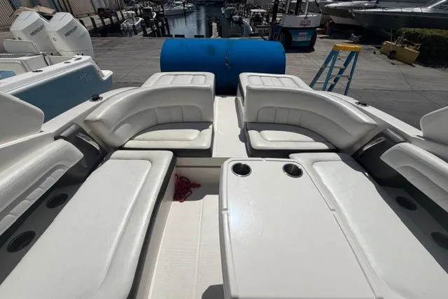Slide: The Image of 2013 Chaparral 277 SSX boat interior with white seating and cup holders. - 5