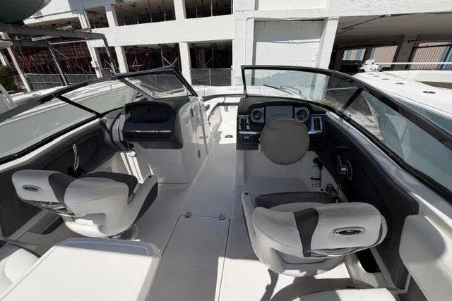 Slide: The Image of 2013 Chaparral 277 SSX boat interior with dual helm seats and dashboard. - 7
