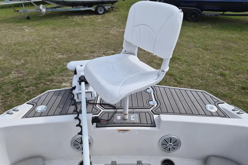 Slide: The Image of 2023 Starcraft SVX 171 OB boat with white swivel seat on deck. - 11