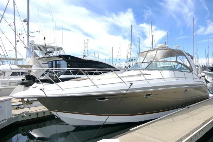 The Image of 2003 Thunderbird Formula 40PC yacht docked at marina under blue sky. - 0