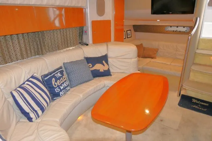Slide: The Image of Luxurious interior of a 2003 Thunderbird Formula 40PC yacht with cozy seating and nautical decor. - 10