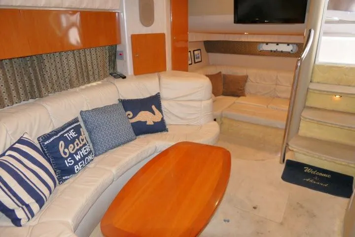 Slide: The Image of Luxurious interior of 2003 Thunderbird Formula 40PC yacht with plush seating and nautical decor. - 11