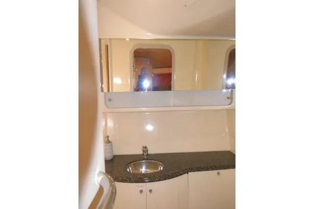 Slide: The Image of 2003 Thunderbird Formula 40PC yacht bathroom with sink and mirror. - 16