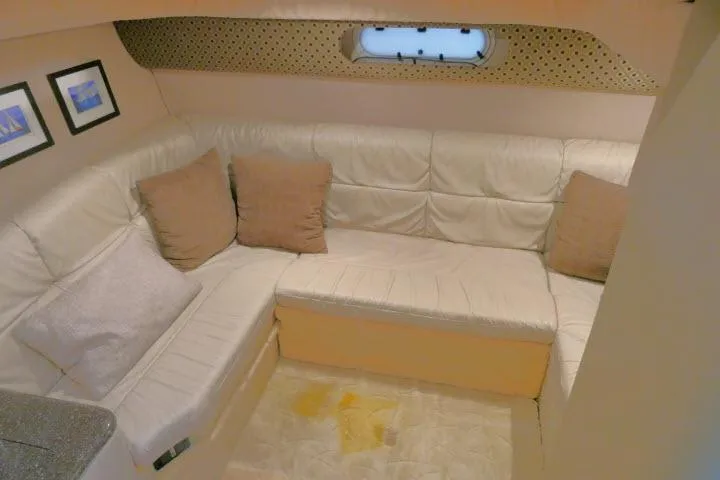 Slide: The Image of Interior of 2003 Thunderbird Formula 40PC yacht with beige leather seating and decorative pillows. - 19