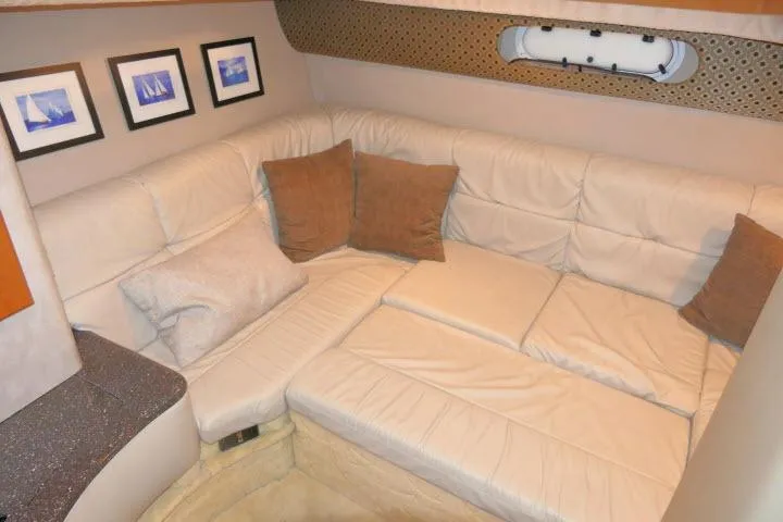 Slide: The Image of Interior of 2003 Thunderbird Formula 40PC yacht with beige leather seating and decorative pillows. - 21