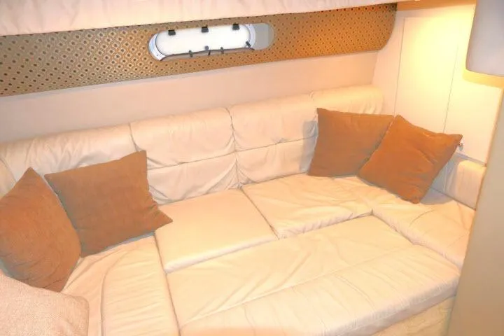 Slide: The Image of Interior of 2003 Thunderbird Formula 40PC yacht with beige seating and brown cushions. - 22