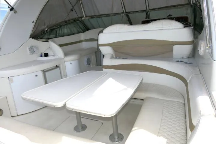 Slide: The Image of Interior of 2003 Thunderbird Formula 40PC yacht with white seating and table. - 23