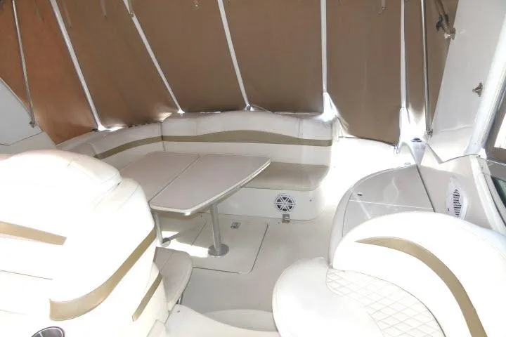 Slide: The Image of Interior of a 2003 Thunderbird Formula 40PC yacht with beige seating and table. - 27