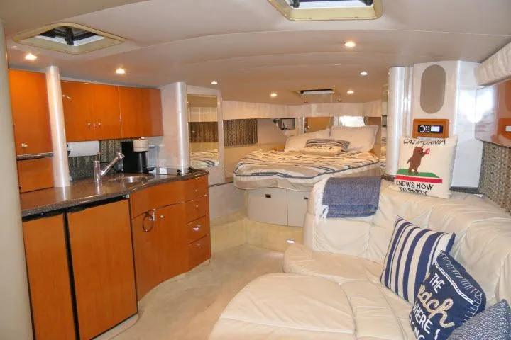Slide: The Image of Luxurious interior of a 2003 Thunderbird Formula 40PC yacht with cozy seating and modern amenities. - 3