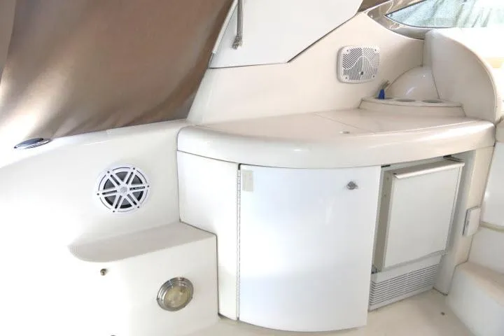 Slide: The Image of 2003 Thunderbird Formula 40PC yacht interior with white cabinetry and built-in speaker. - 30
