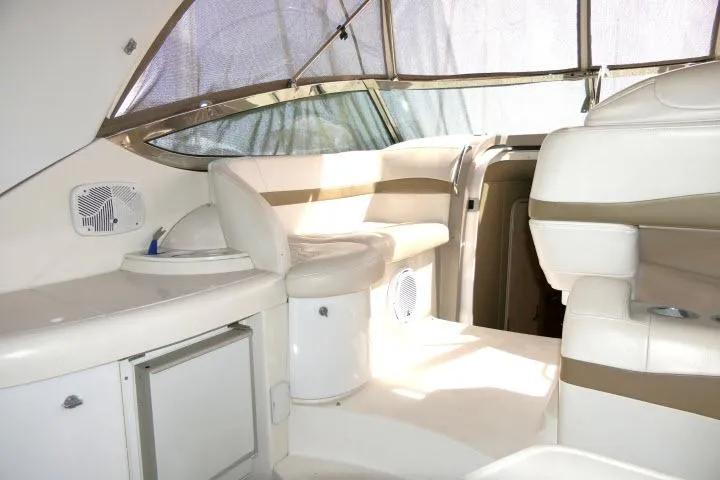 Slide: The Image of 2003 Thunderbird Formula 40PC yacht interior with white seating and modern design. - 31