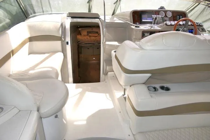 Slide: The Image of Interior of a 2003 Thunderbird Formula 40PC boat with white leather seating. - 33