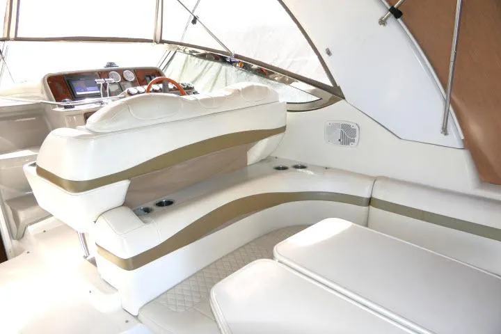 Slide: The Image of Luxurious interior of a 2003 Thunderbird Formula 40PC yacht with plush seating and modern dashboard. - 34