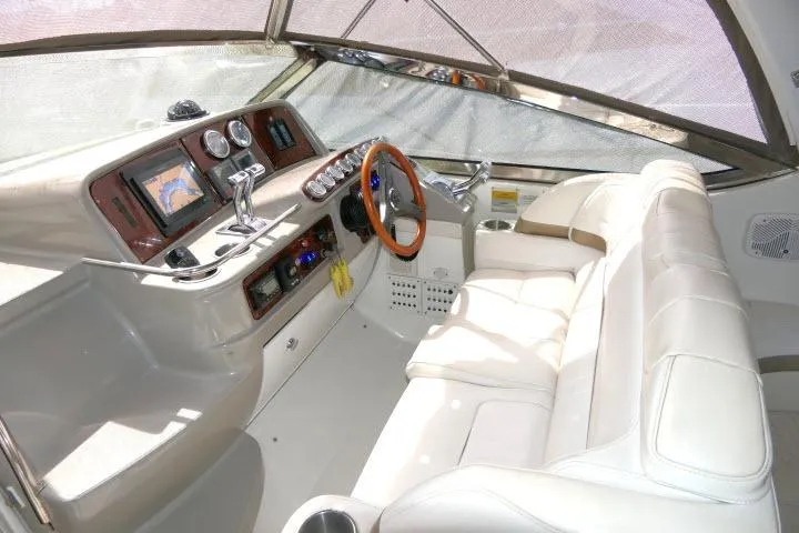 Slide: The Image of 2003 Thunderbird Formula 40PC yacht cockpit with leather seating and modern dashboard controls. - 35