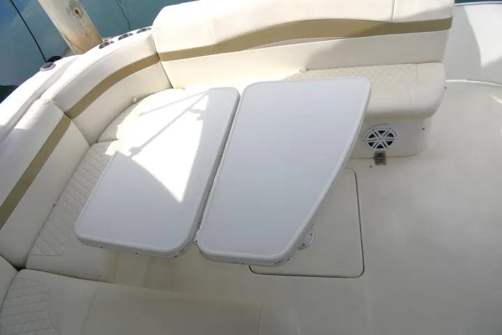 Slide: The Image of 2003 Thunderbird Formula 40PC boat interior with beige seating and foldable table. - 39