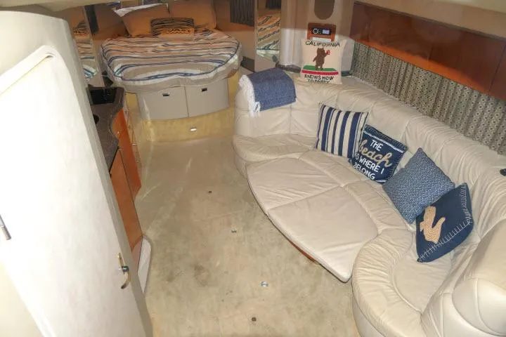 Slide: The Image of 2003 Thunderbird Formula 40PC yacht interior with cozy seating and bed area. - 4