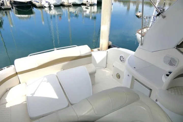 Slide: The Image of Luxurious 2003 Thunderbird Formula 40PC yacht interior with plush seating at marina. - 41