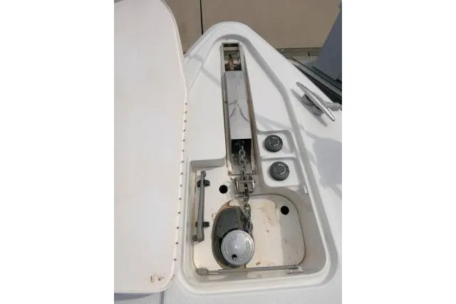 Slide: The Image of Anchor compartment of 2003 Thunderbird Formula 40PC boat, featuring stainless steel fittings. - 44